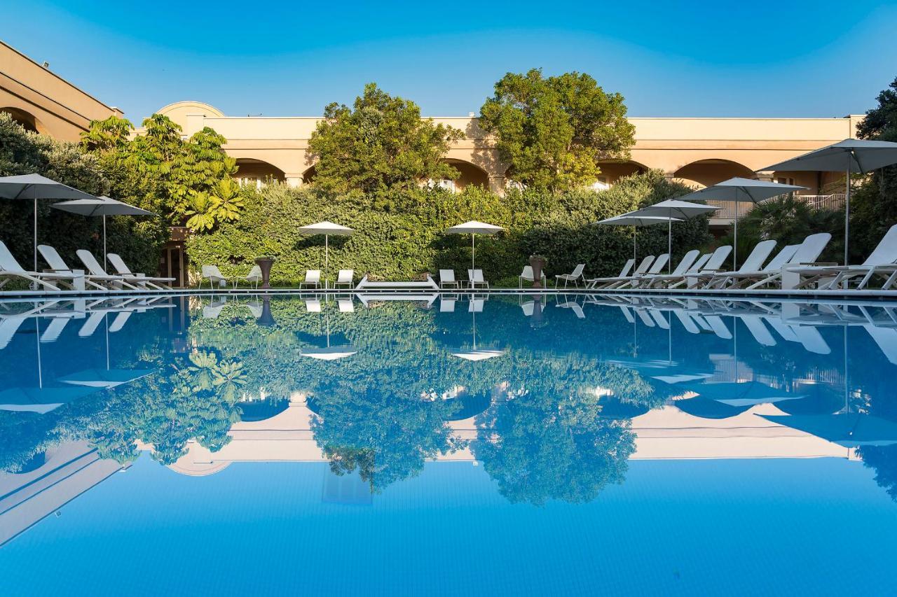 罗曼诺宫豪华酒店 卡塔尼亚 外观 照片 The swimming pool at the hotel